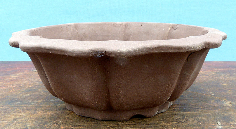 Bonsai Basics - Round Unglazed Bonsai Pot - 7" Being hand made basic quality some finish, colour and size variations, minor distortions and marks can occur.
